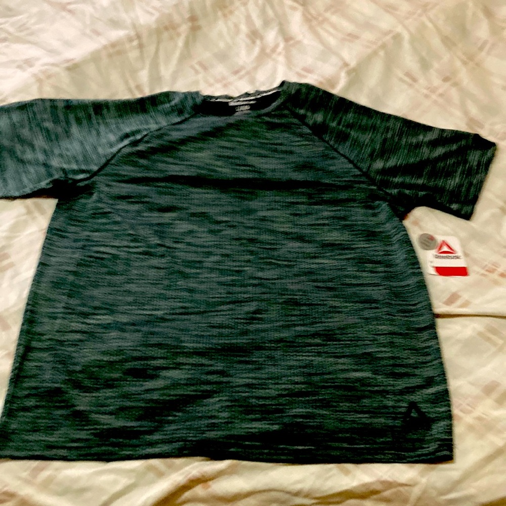 Reebok T-Shirt light and dark color green. The shirt is new never been worn..!!